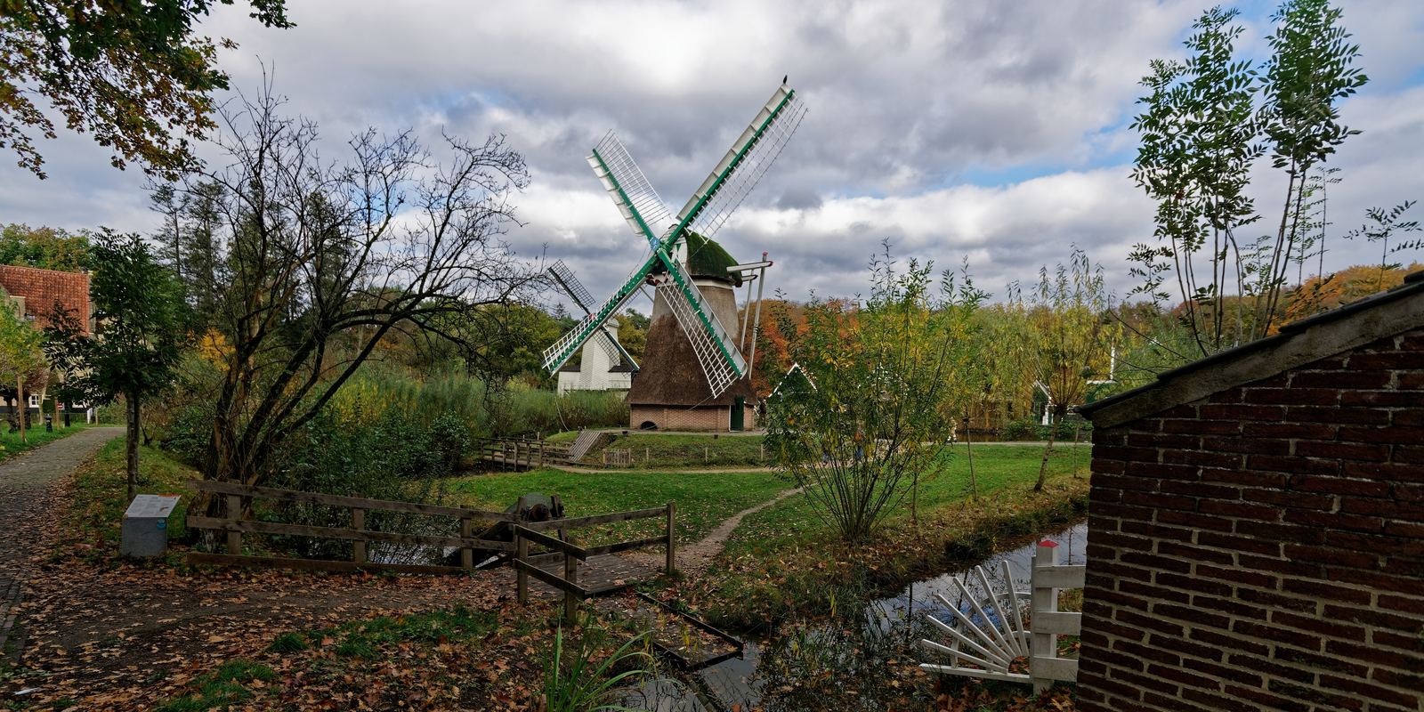 A large wooden Archimedes screw at an open-air museum