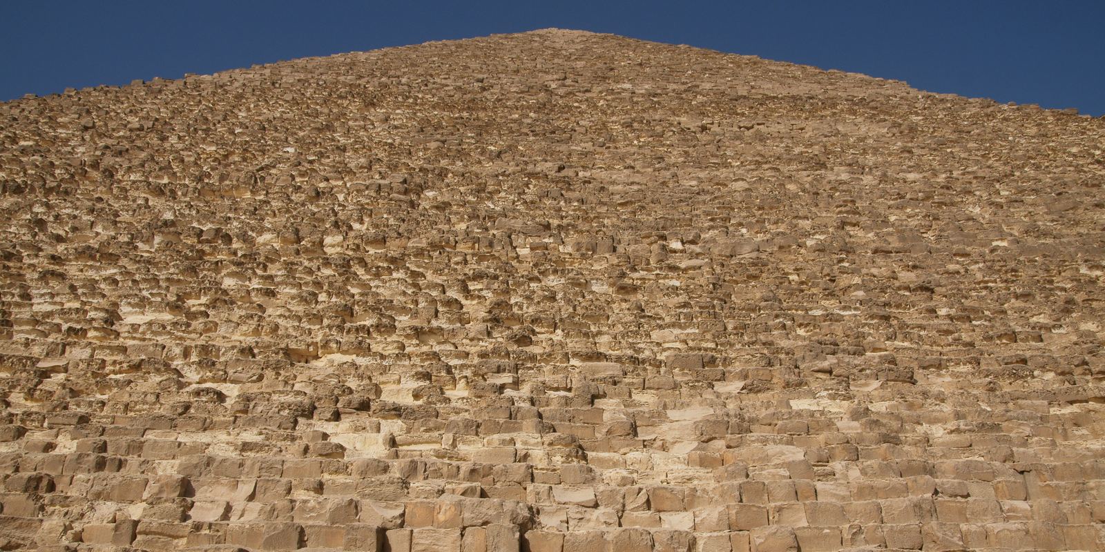 The stepped limestone side of the Great Pyramid of Giza
