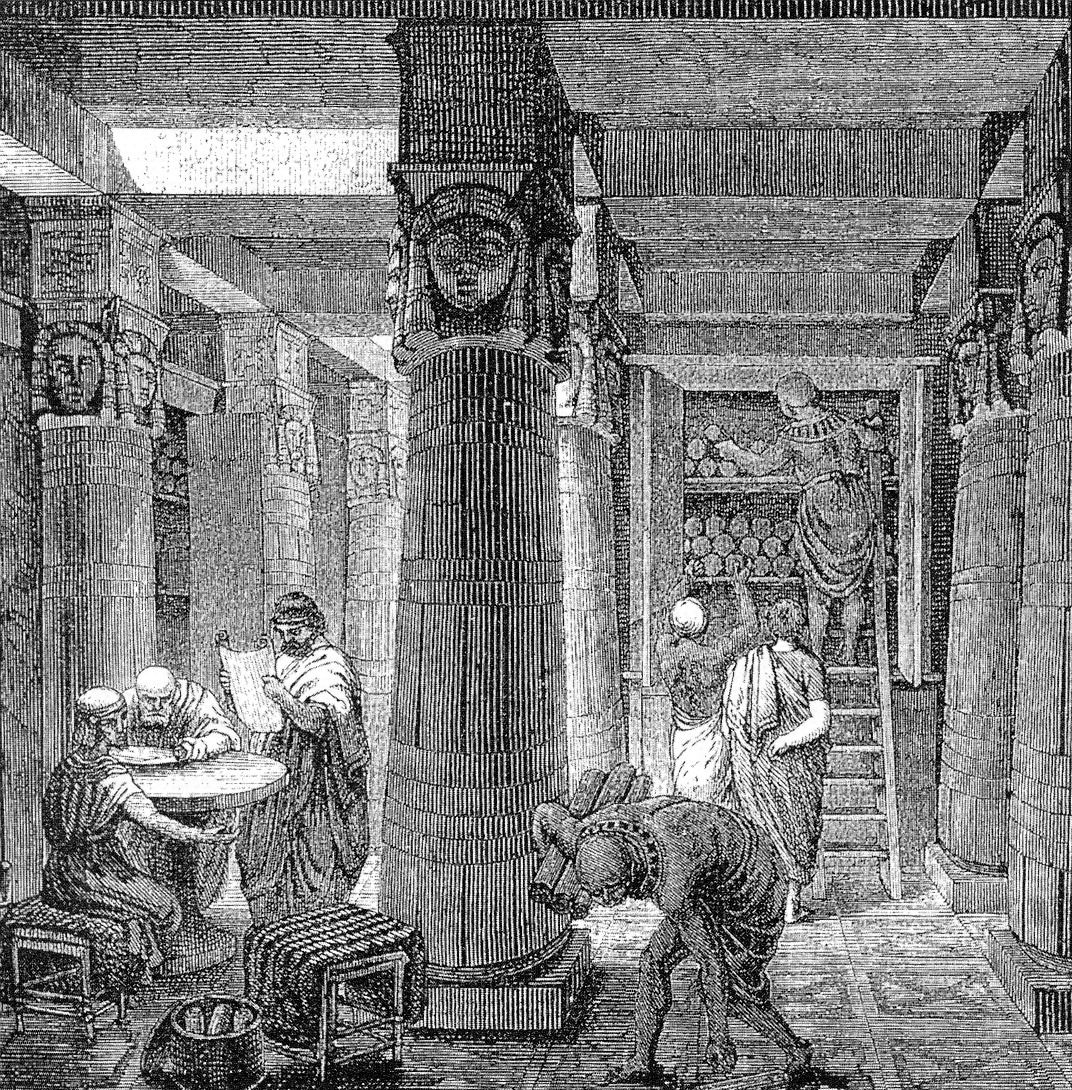 A 19th-century engraving imagining scholars reading scrolls among tall columns and scroll-filled shelves in the ancient Library of Alexandria